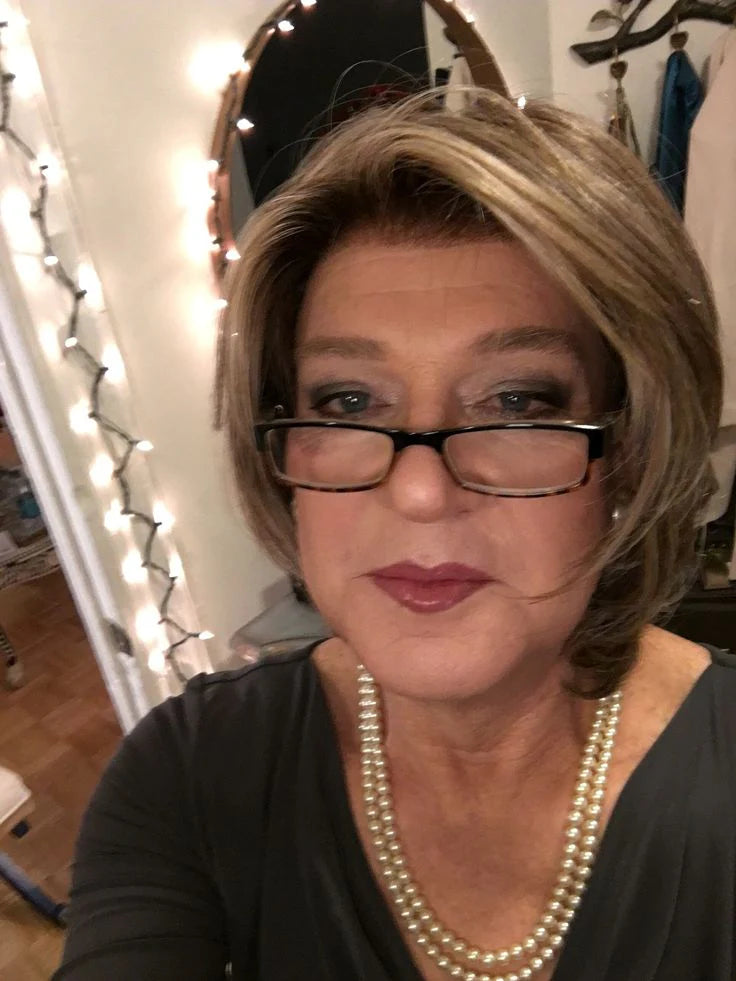 files/An_older_woman_taking_her_selfie__And_with_a_new_hair_do_and_makeup_done_by_my_dear_friend_Monica_I_m_feeling_pretty_good_about_the_results.webp